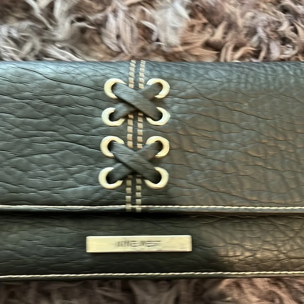 Black with silver details and lacing wristlet good condition